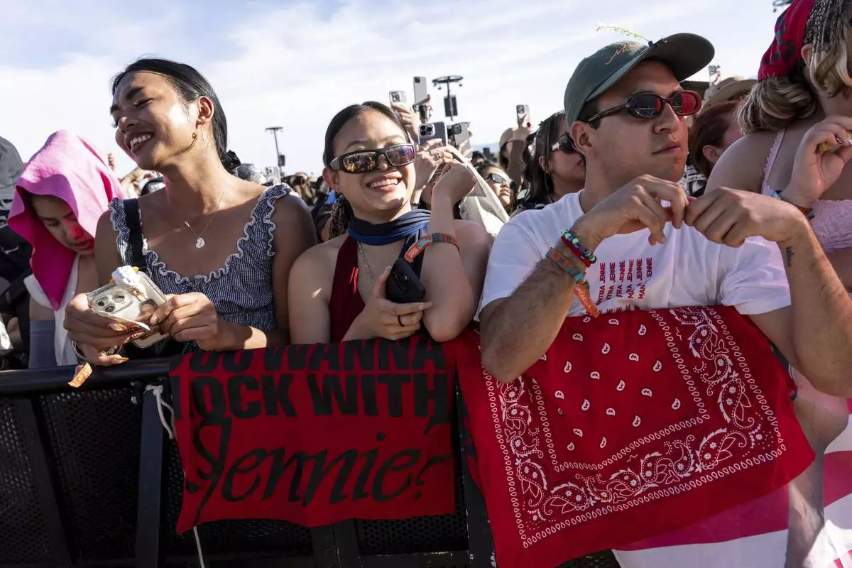 Festivalgoers are seen during the first weekend of the Coachella Valley Music and Arts Festival at the Empire Polo Club on Sunday, April 13, 2025, in Indio, Calif. (Photo by Amy Harris/Invision/AP)