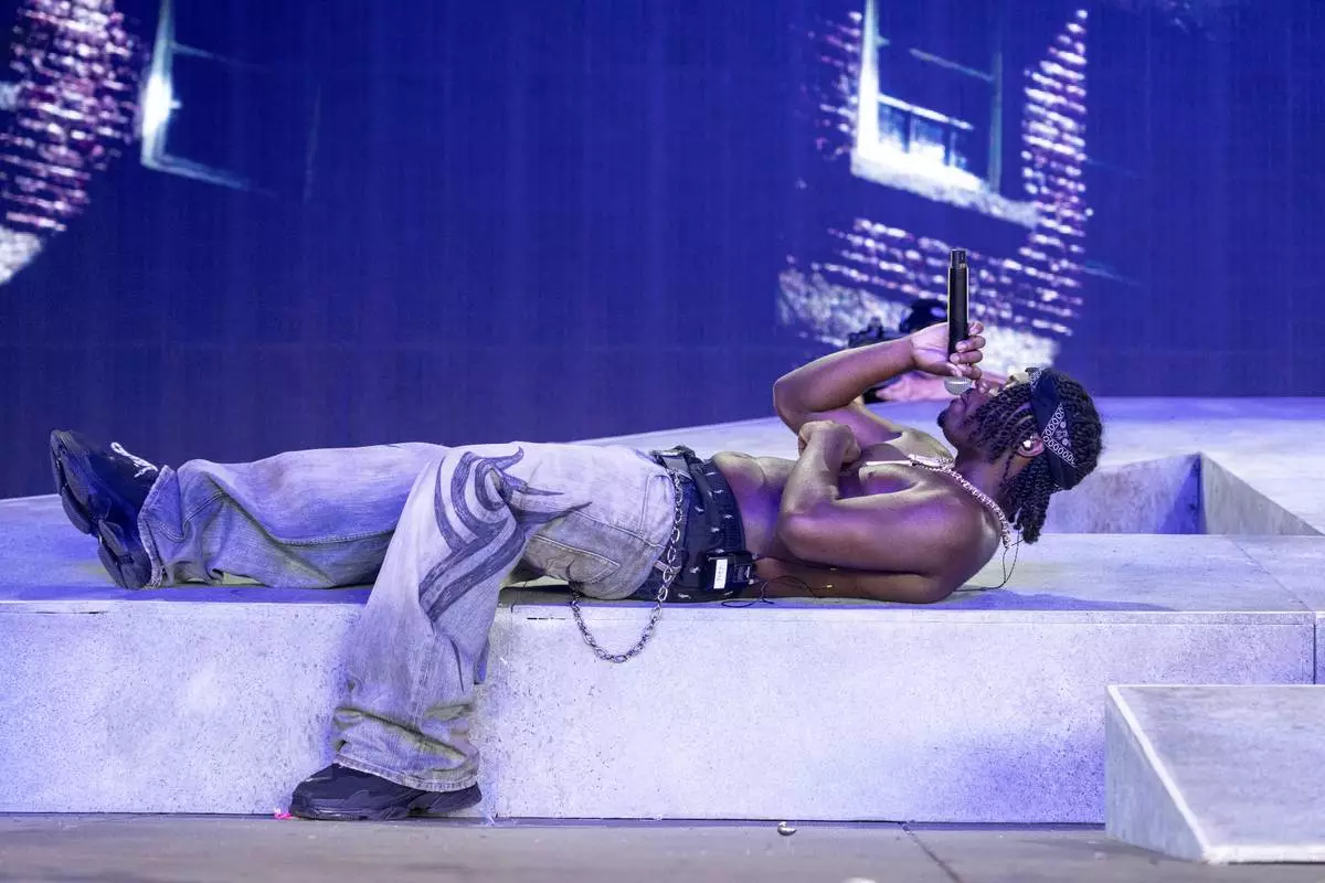 CORRECTS NAME TO 4BATZ - 4batz performs during the first weekend of the Coachella Valley Music and Arts Festival at the Empire Polo Club on Friday, April 11, 2025, in Indio, Calif. (Photo by Amy Harris/Invision/AP)