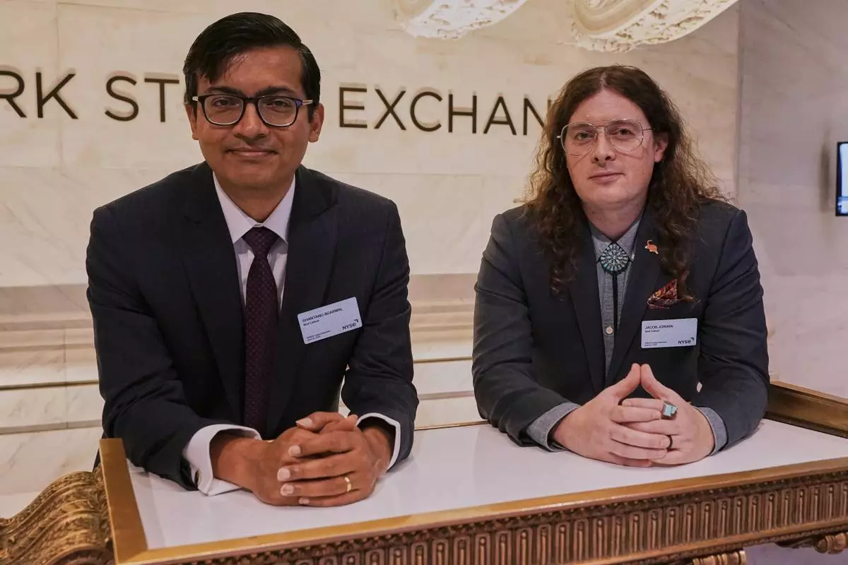 XPRIZE Carbon Removal winners from Mati Carbon, Founder & CEO Shantanu Agarwal, left, and Chief Science Officer Jake Jordan, visit the trading floor of the New York Stock Exchange, Tuesday, April 22, 2025. (AP Photo/Richard Drew)