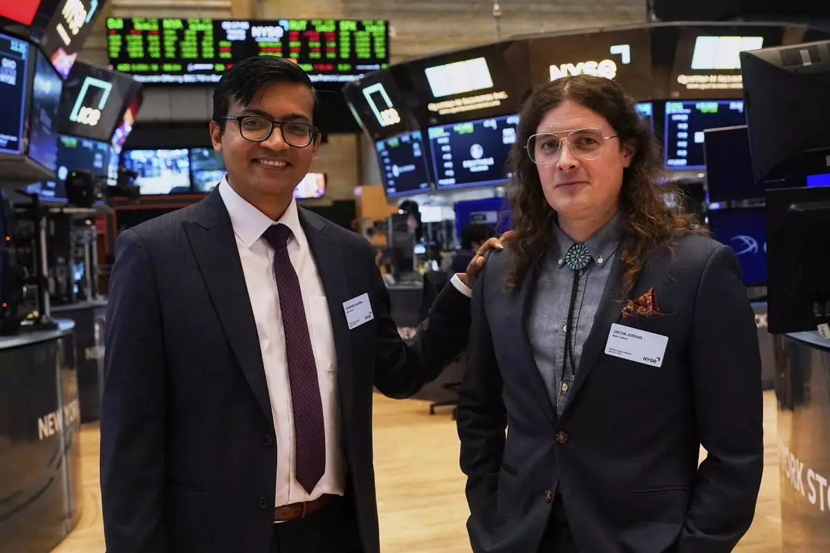XPRIZE Carbon Removal winners from Mati Carbon, Founder & CEO Shantanu Agarwal, left, and Chief Science Officer Jake Jordan, visit the trading floor of the New York Stock Exchange, Tuesday, April 22, 2025. (AP Photo/Richard Drew)