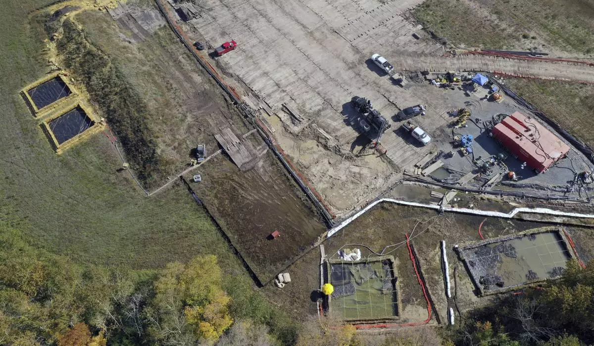 FILE - Crews prepare for remediation to temporarily reduce the confined aquifer pressure near Clearbrook, Minn., on Sept. 28, 2021. (Brian Peterson/Star Tribune via AP, file)