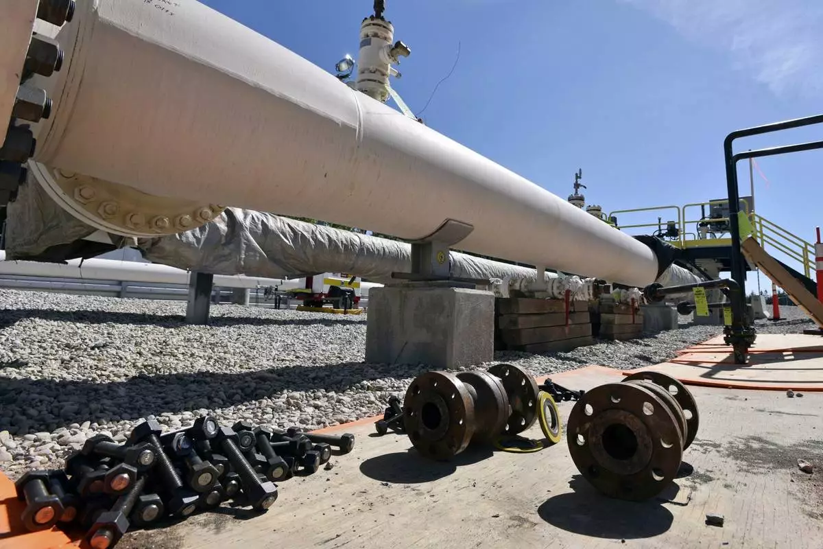 FILE - Nuts, bolts and fittings are shown near St. Ignace, Mich., ahead of work on the Line 5 pipeline, which runs beneath the Straits of Mackinac that connects Lake Michigan and Lake Huron, June 8, 2017. (Dale G Young/Detroit News via AP, File)