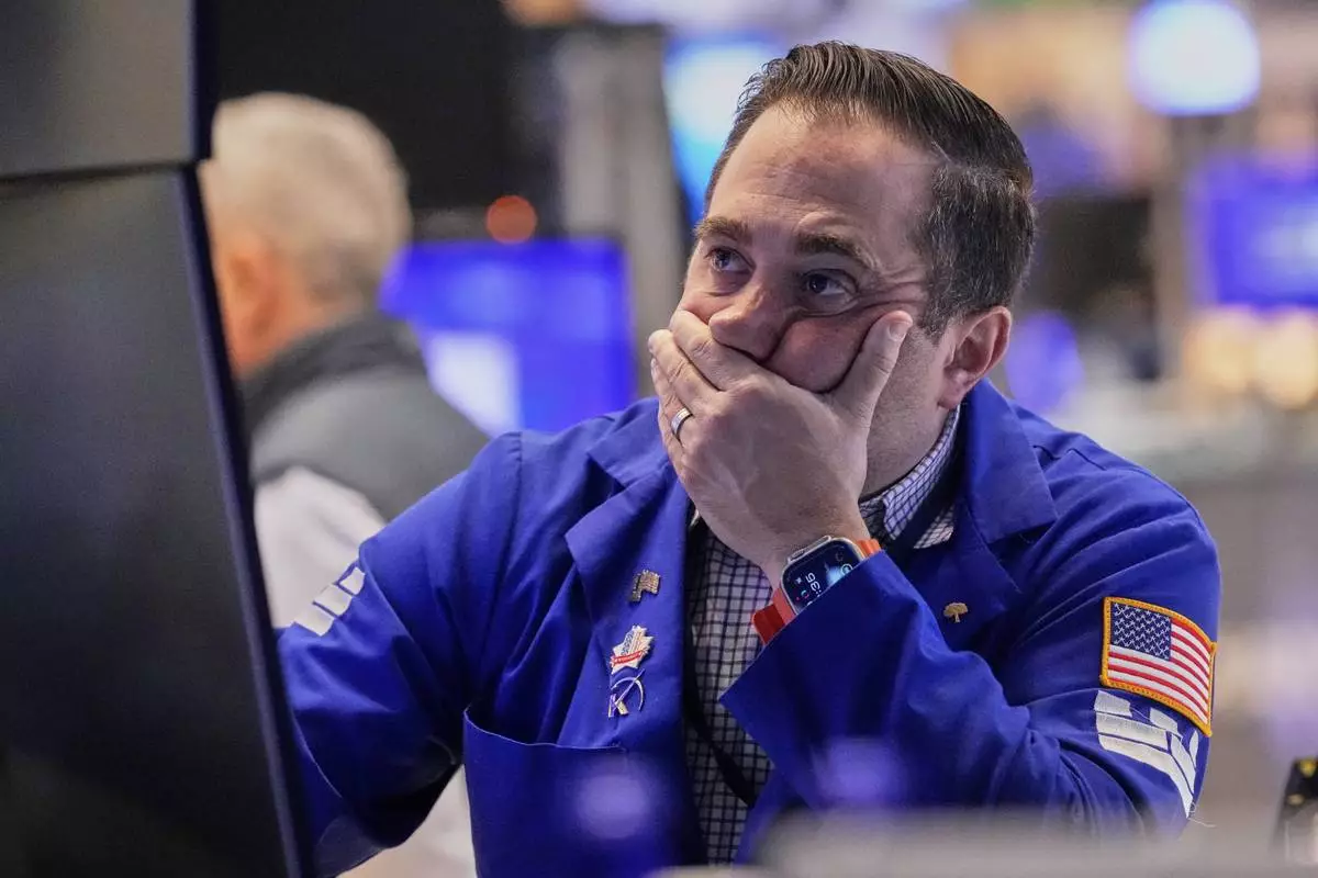 Specialist Gennaro Saporito works on the floor of the New York Stock Exchange, Wednesday, April 16, 2025. (AP Photo/Richard Drew)