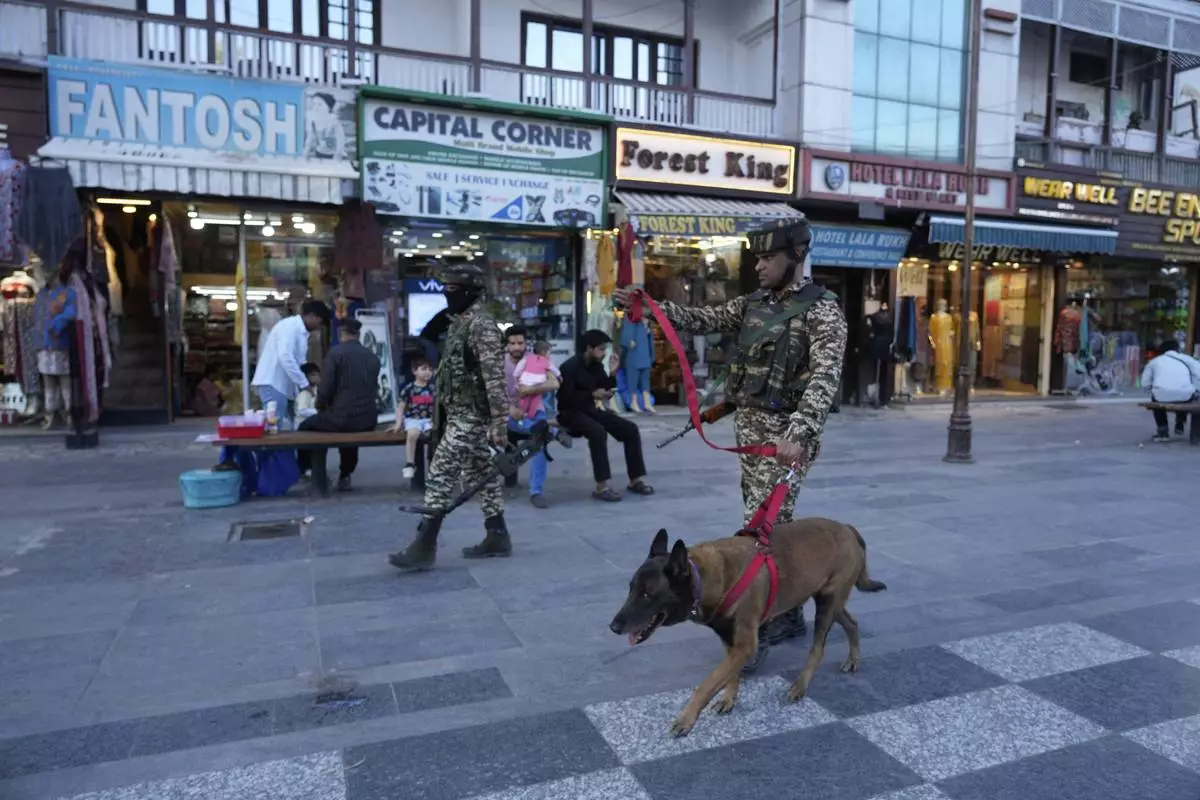 Indian paramilitary soldiers patrol as they guard at a busy market in Srinagar, Indian controlled Kashmir, Tuesday, April 29, 2025. (AP Photo/Mukhtar Khan)