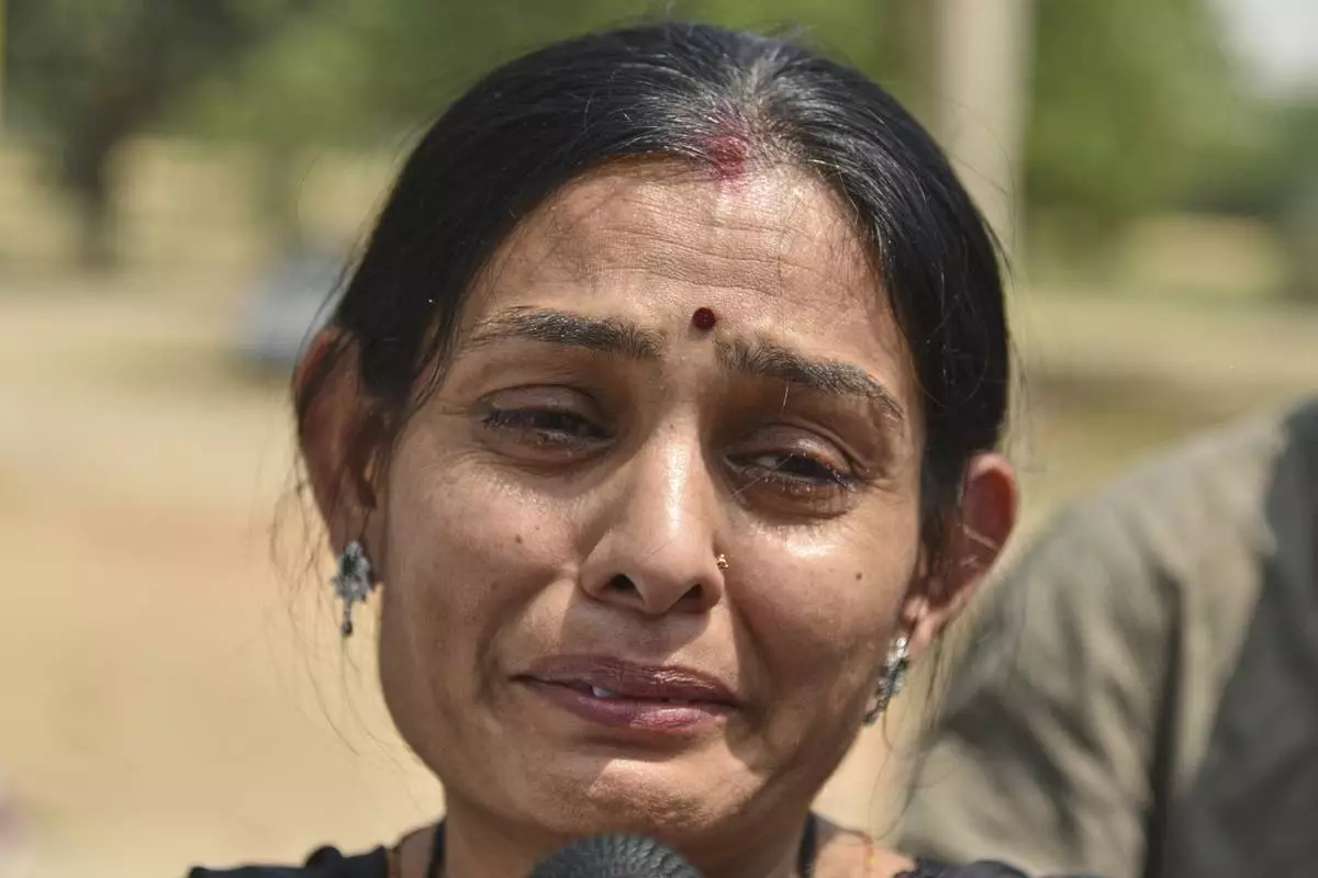 Indian national Komal breaks down while seeing off her brother and his wife, both Pakistani citizens, at the Attari-Wagah border between India and Pakistan, near Amritsar, India, Tuesday, April 29, 2025. (AP Photo/Prabhjot Gill)