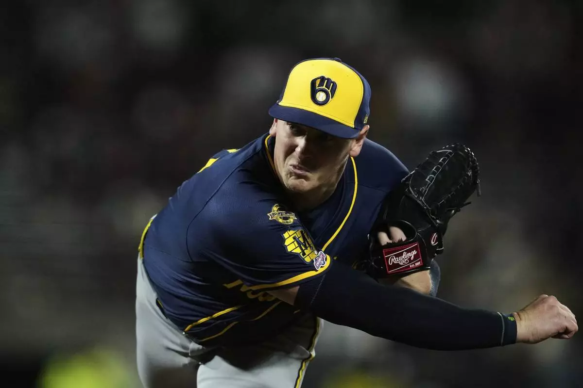 Milwaukee Brewers pitcher Craig Yoho follows through on his throw to a San Francisco Giants batter during the eighth inning of a baseball game Monday, April 21, 2025, in San Francisco. (AP Photo/Godofredo A. Vásquez)