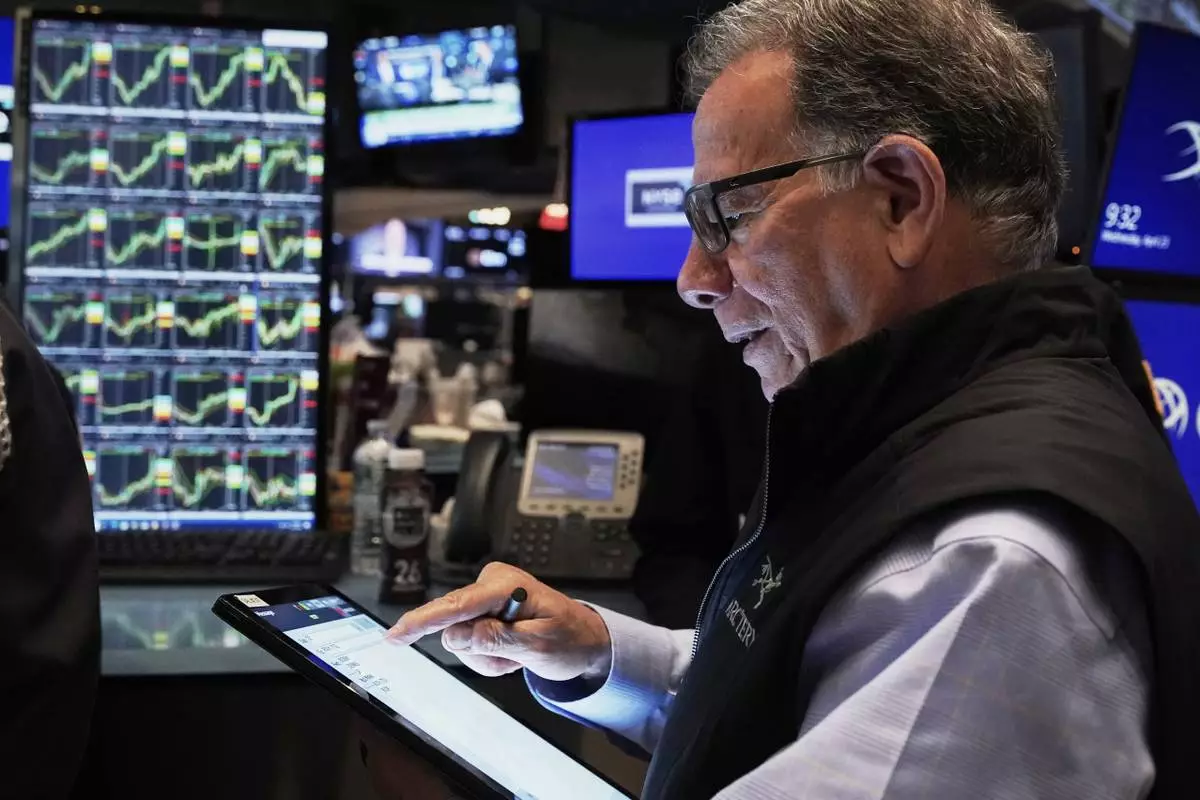 Trader Sal Suarino works on the floor of the New York Stock Exchange, Wednesday, April 23, 2025. (AP Photo/Richard Drew)