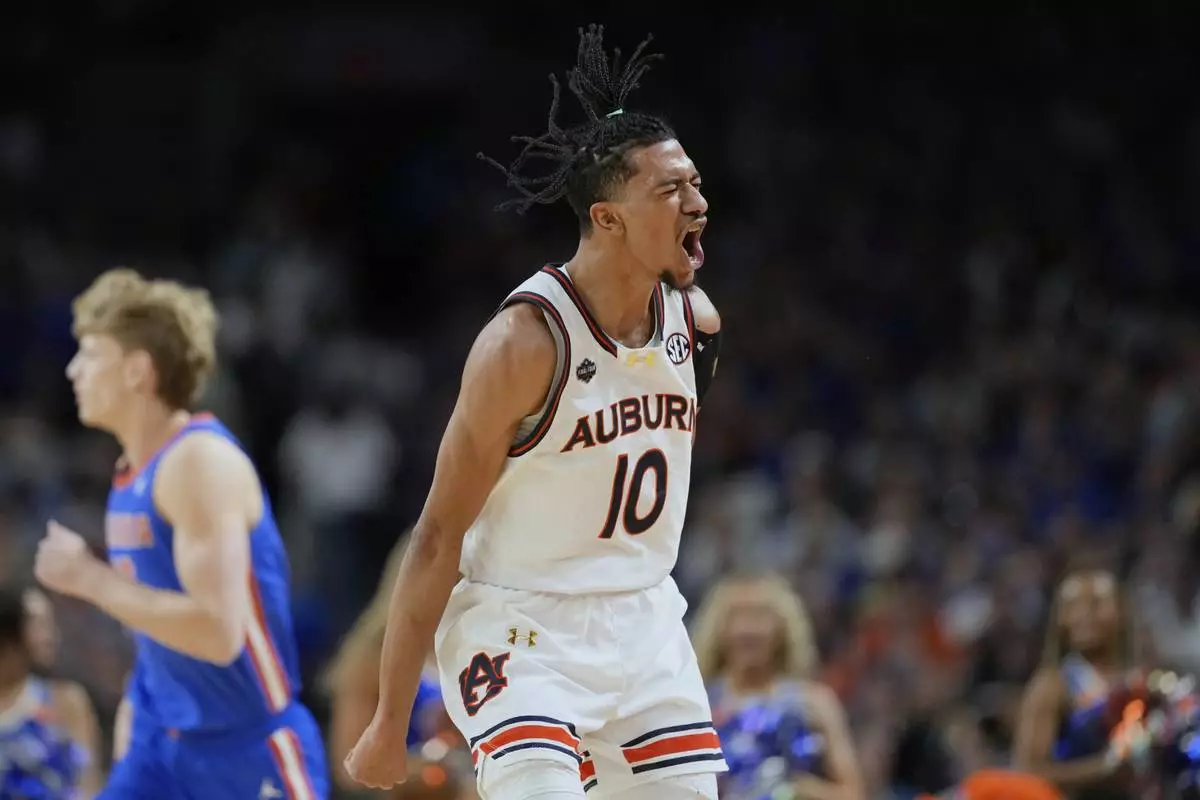 Auburn's Chad Baker-Mazara (10) celebrates during the first half in the national semifinals at the Final Four of the NCAA college basketball tournament, Saturday, April 5, 2025, in San Antonio. (AP Photo/Eric Gay)