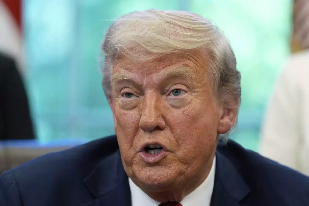 President Donald Trump speaks with reporters after signing executive orders in the Oval Office of the White House, Wednesday, April 23, 2025, in Washington. (AP Photo/Alex Brandon)