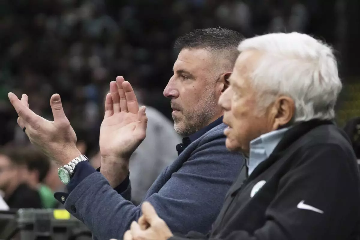 New England Patriots head coach Mike Vrabel, left, applauds while seated with team owner Robert Kraft during the first half in game 2 of a first-round NBA playoff basketball series between the Boston Celtics and Orlando Magic, Wednesday, April 23, 2025, in Boston. (AP Photo/Charles Krupa)
