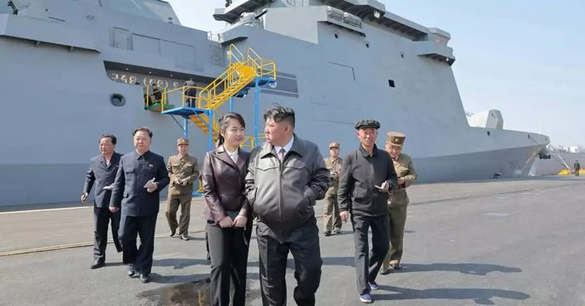 North Korea's Kim watches missile test-firings from country's first destroyer