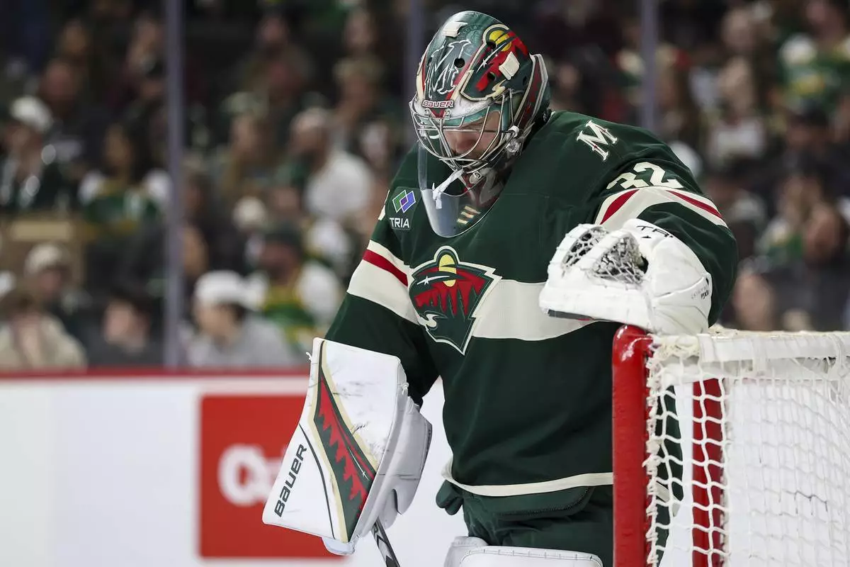 Minnesota Wild goaltender Filip Gustavsson looks on during the second period of an NHL hockey game against the Anaheim Ducks, Tuesday, April 15, 2025, in St. Paul, Minn. (AP Photo/Matt Krohn)