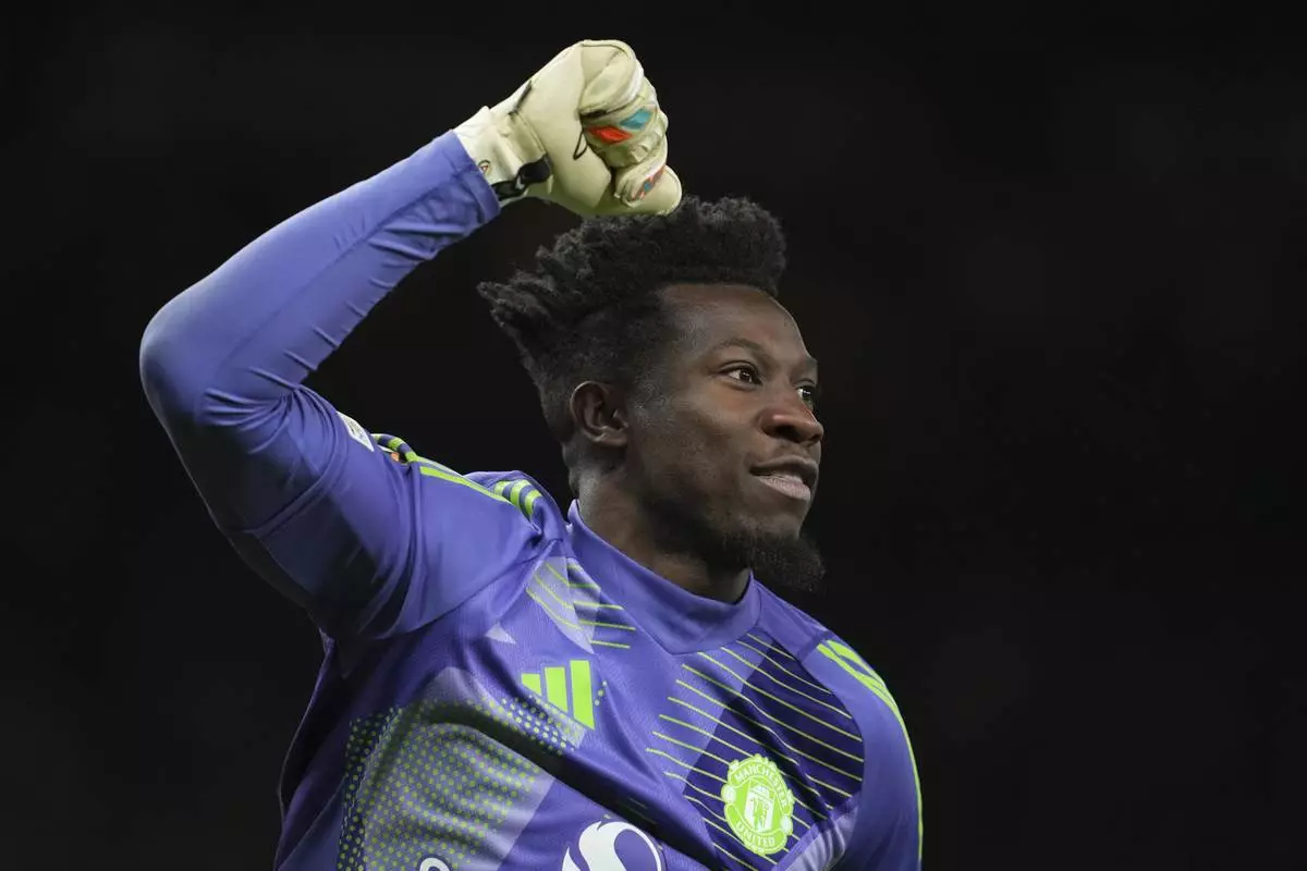 Manchester United's goalkeeper Andre Onana celebrates during the Europa League quarter final second leg soccer match between Manchester United and Olympique Lyon in Manchester, Britain, Thursday, April 17, 2025. (AP Photo/Jon Super)