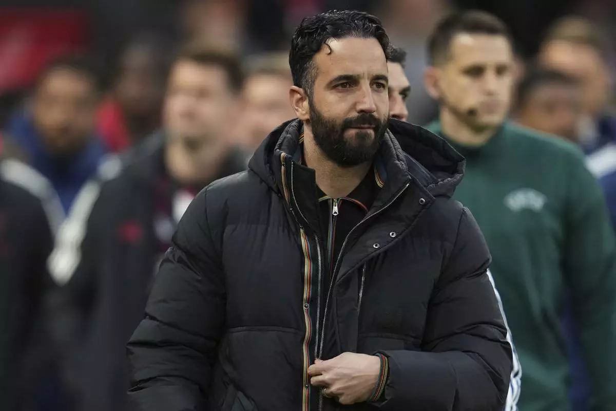 Manchester United's head coach Ruben Amorim arrives for the Europa League quarter final second leg soccer match between Manchester United and Olympique Lyon in Manchester, Britain, Thursday, April 17, 2025. (AP Photo/Jon Super)
