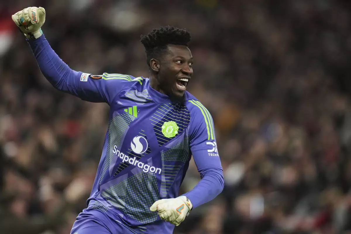 Manchester United's goalkeeper Andre Onana celebrates during the Europa League quarter final second leg soccer match between Manchester United and Olympique Lyon in Manchester, Britain, Thursday, April 17, 2025. (AP Photo/Jon Super)