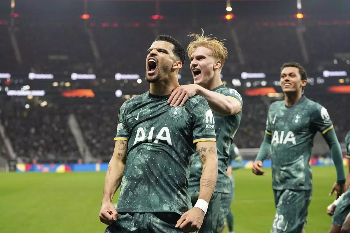 Tottenham's Dominic Solanke celebrates after scoring his side's opening goal during the Europa League quarterfinal second leg soccer match between Eintracht Frankfurt and Tottenham Hotspur, in Frankfurt, Germany, Thursday, April 17, 2025. (AP Photo/Martin Meissner)