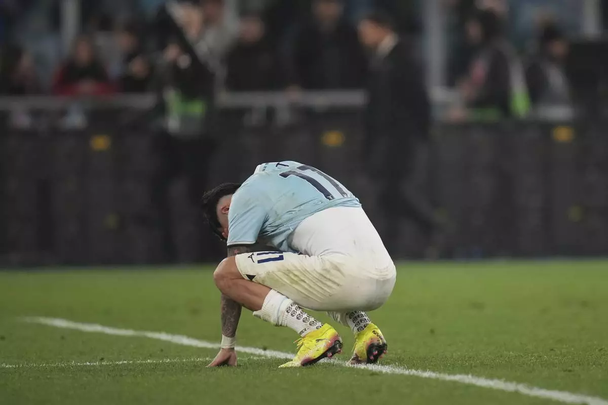 Lazio's Taty Castellanos reacts after a miss during penalty shootout during the Europe League quarter final second leg match between Lazio and Bodo Glimt in Rome, Italy, Thursday, April 17, 2025. (AP Photo/Alessandra Tarantino)