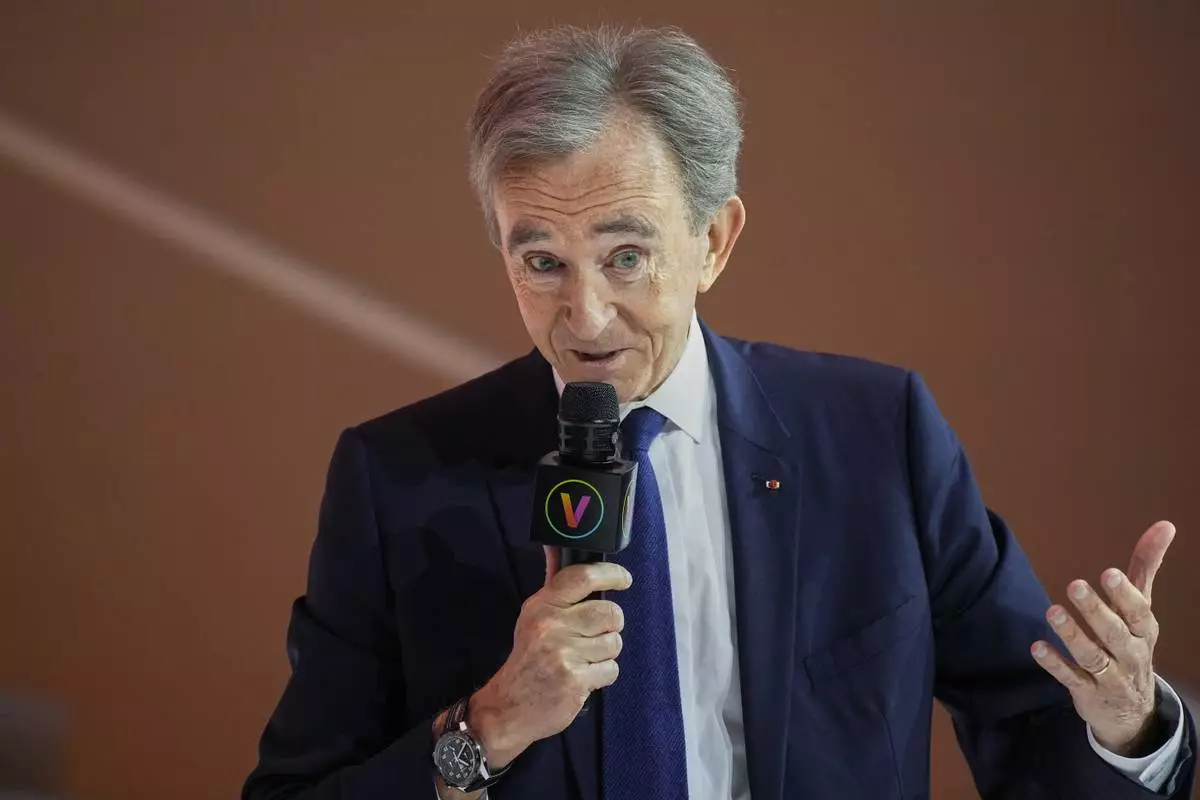 FiILE - LVMH group CEO Bernard Arnault speaks at the Vivatech show in Paris, Thursday, June 15, 2023. (AP Photo/Michel Euler, File)