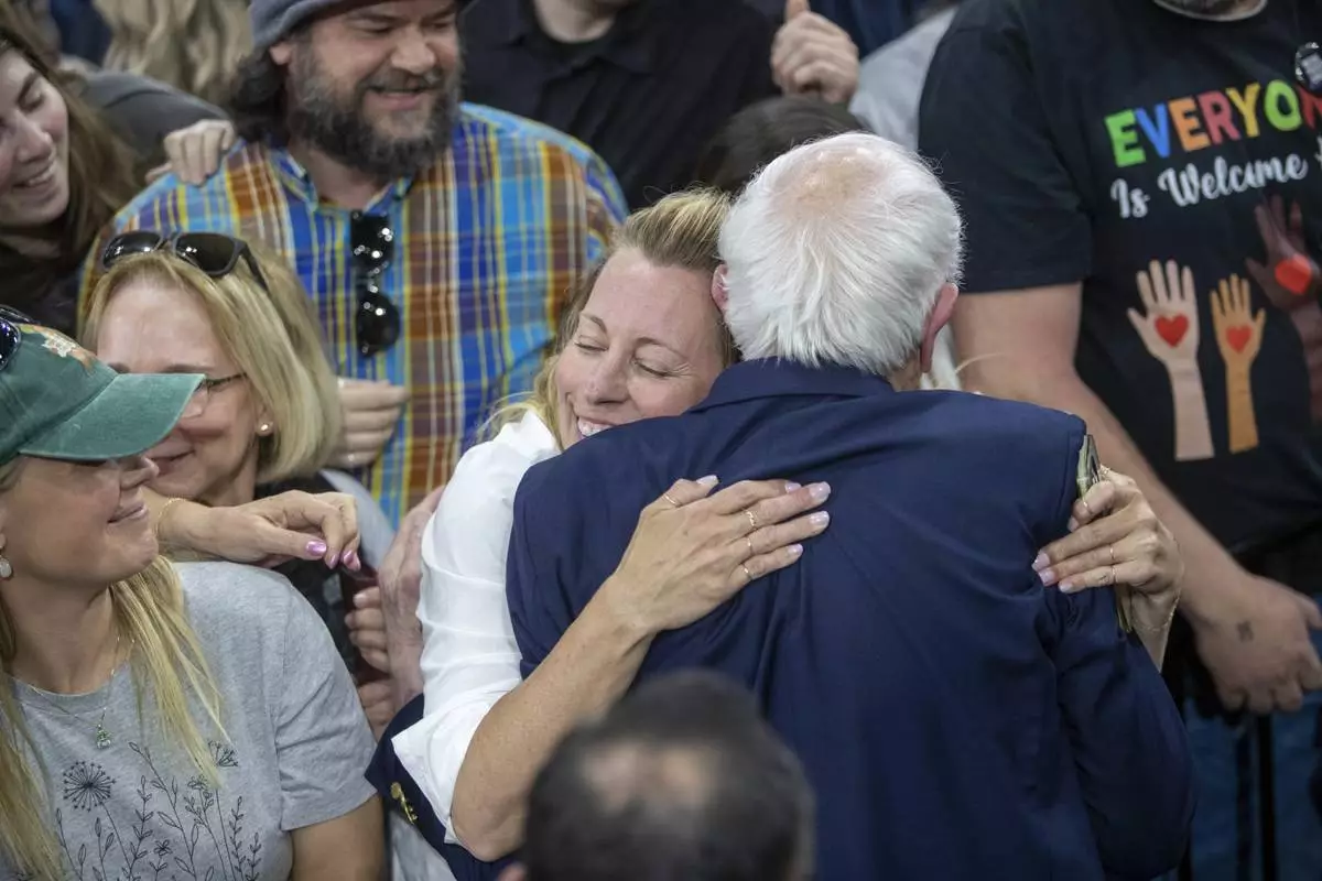 An attendee hugs Sen. Bernie Sanders, I-Vt., after his "Fighting Oligarchy" event at the Ford Idaho Center in Nampa, Idaho, Monday, April 14, 2025. (AP Photo/Kyle Green)