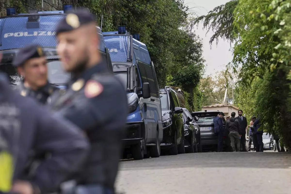 Police patrol outside the Omani Embassy in Rome during a closed-door meeting between U.S. and Iranian delegations to discuss Tehran's rapidly advancing nuclear program, Saturday, April 19, 2025. (AP Photo/Andrew Medichini)