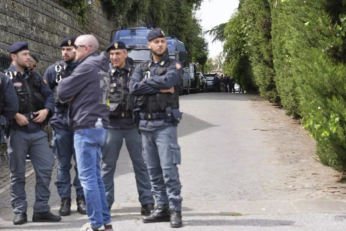 Police patrol outside the Omani Embassy in Rome during a closed-door meeting between U.S. and Iranian delegations to discuss Tehran's rapidly advancing nuclear program, Saturday, April 19, 2025. (AP Photo/Andrew Medichini)