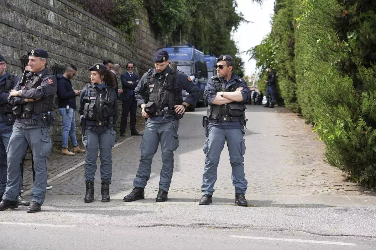 Police patrol outside theOmani Embassy in Rome during a closed-door meeting between U.S. and Iranian delegations to discuss Tehran's rapidly advancing nuclear program, Saturday, April 19, 2025. (AP Photo/Andrew Medichini)