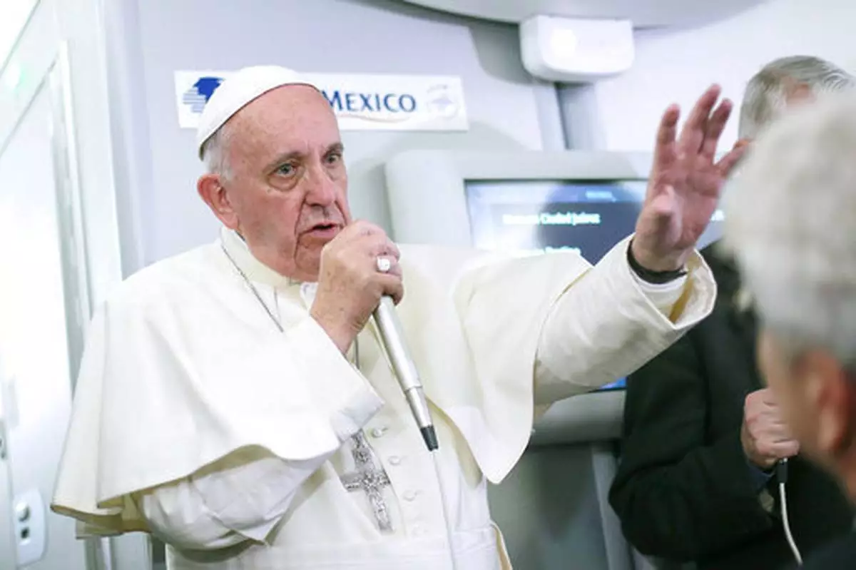 FILE - Pope Francis speaks to journalists aboard the plane during the flight from Ciudad Juarez, Mexico to Rome, where he suggested that women threatened with the Zika virus could use artificial contraception but not abort their fetus, Wednesday, Feb. 17, 2016. (Alessandro Di Meo/Pool Photo via AP, File)