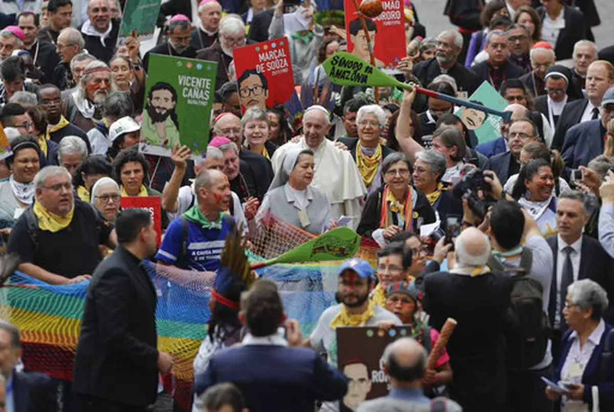 FILE - Pope Francis walks in procession on the occasion of the Amazon synod, a three-week meeting on preserving the rainforest and ministering to its native people, at the Vatican, Monday, Oct. 7, 2019. (AP Photo/Andrew Medichini, file)