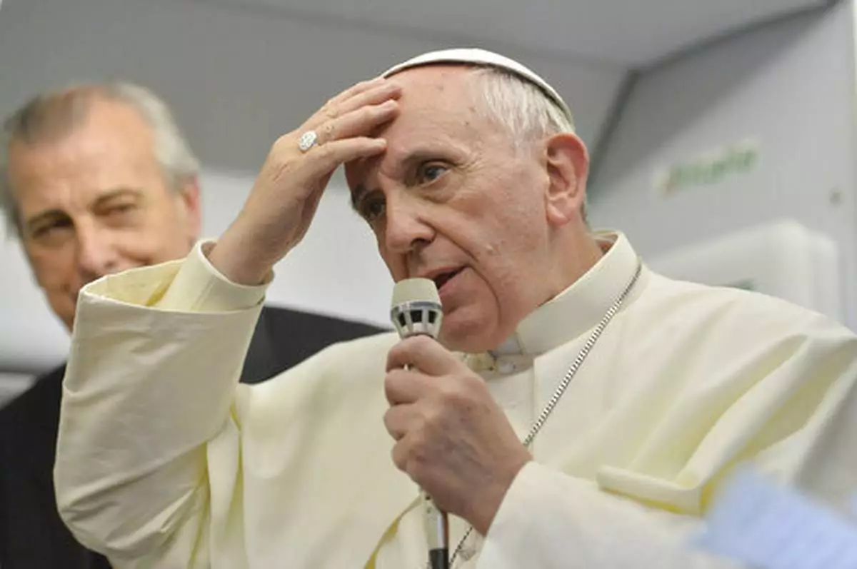 FILE - Pope Francis speaks during a news conference aboard the papal flight on its way back from Brazil, where he famously uttered "Who am I to judge?" when asked about a Vatican monsignor who purportedly had a gay lover in his past, Monday, July 29, 2013. (AP Photo/Luca Zennaro, Pool, file)
