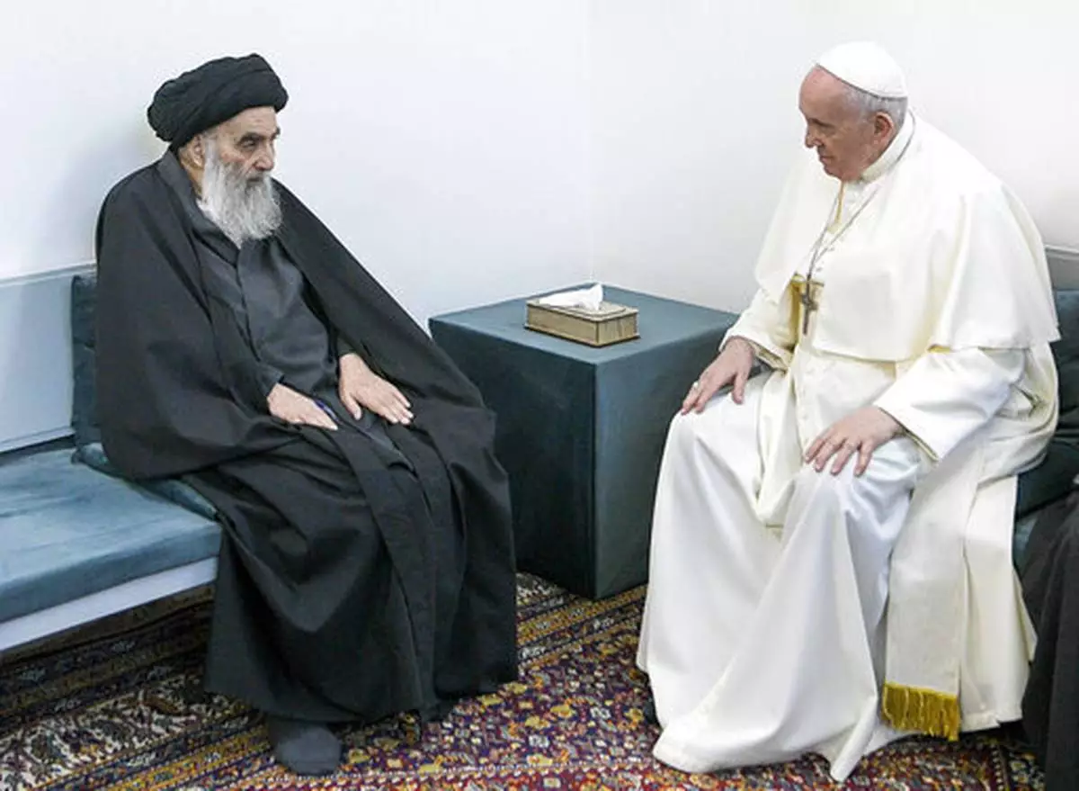 FILE - In this March 6, 2021 file photo, Pope Francis, right, meets with Iraq's leading Shiite cleric, Grand Ayatollah Ali al-Sistani in Najaf, Iraq. Pope Franics became the first pope to visit both the Arabian Peninsula and Iraq, the birthplace of Abraham, a prophet important to Christians, Muslims and Jews. (AP Photo/Vatican Media, file)