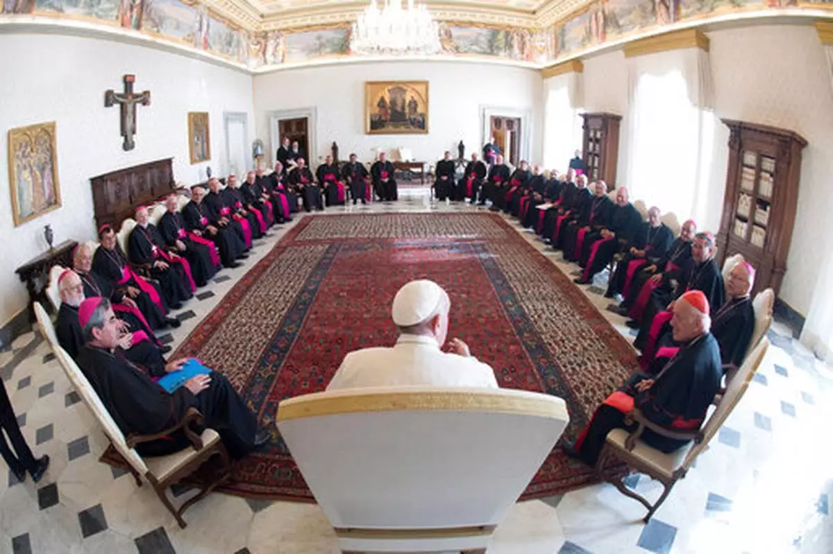 FILE - In this Feb. 20, 2017 file photo, Pope Francis meets with the Chilean Bishops Conference, at the Vatican. (L'Osservatore Romano/Pool Photo via AP, file)