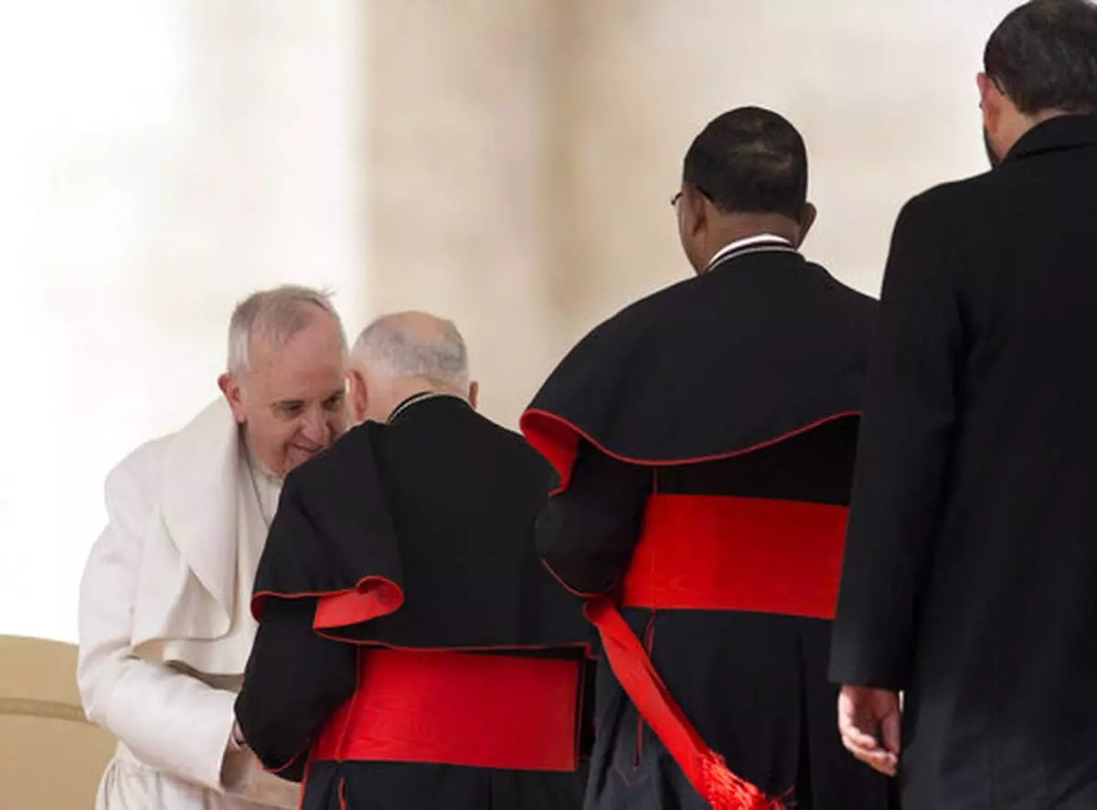FILE - In this Feb. 19, 2014 file photo, Pope Francis greets U.S. cardinal Theodore Edgar McCarrick at the end of his general audience, in St. Peter's Square at the Vatican. (AP Photo/Alessandra Tarantino, file)