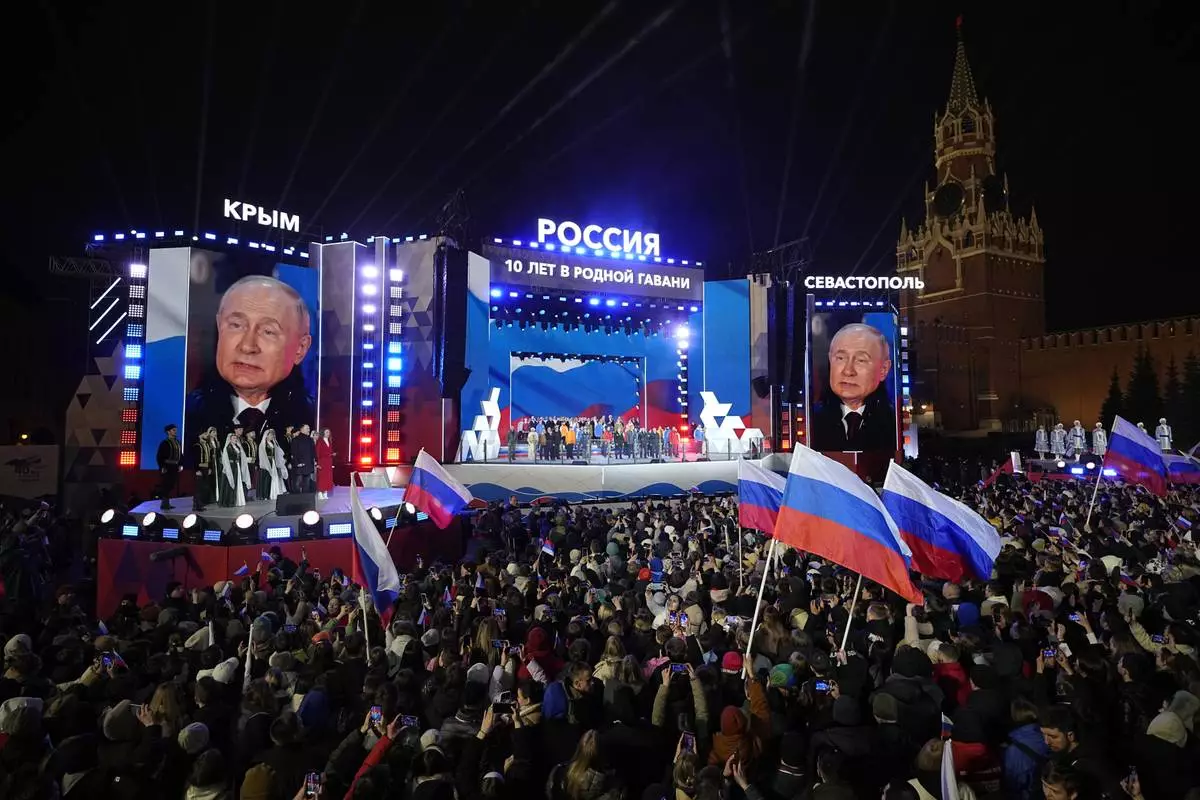 FILE - Russian President Vladimir Putin is seen on a screen as he attends a concert in Red Square in Moscow, on March 18, 2024, marking the 10th anniversary of Russia’s annexation of Crimea. (AP Photo/Alexander Zemlianichenko, File)