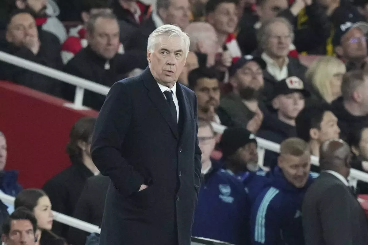 Real Madrid's head coach Carlo Ancelotti reacts during the Champions League quarterfinal first leg soccer match between Arsenal and Real Madrid at the Emirates Stadium in London, Tuesday, April 8, 2025. (AP Photo/Frank Augstein)