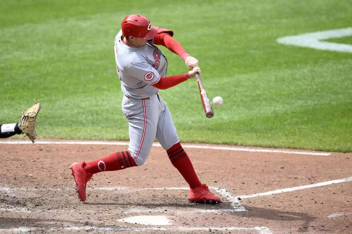 Cincinnati Reds' Austin Hays hits a RBI double during the fifth inning of a baseball game against the Baltimore Orioles, Sunday, April 20, 2025, in Baltimore. (AP Photo/Nick Wass)