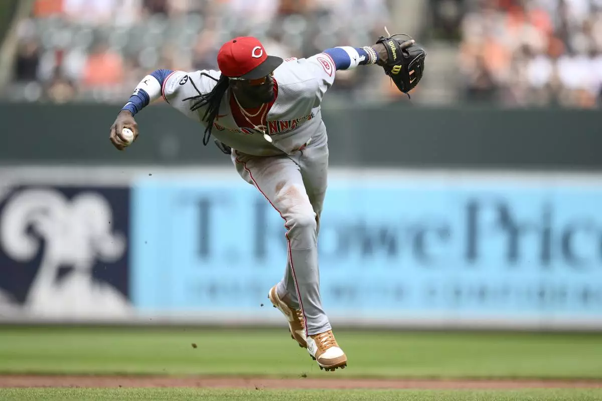 Cincinnati Reds shortstop Elly De La Cruz throws to first on a ball hit by Baltimore Orioles' Cedric Mullins for a single, after a review, during the first inning of a baseball game, Sunday, April 20, 2025, in Baltimore. (AP Photo/Nick Wass)