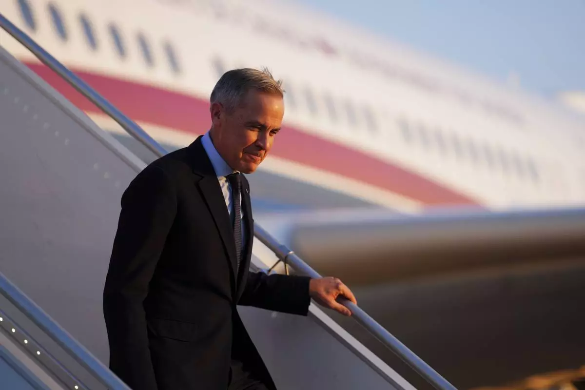 FILE - Canada's Prime Minister Mark Carney arrives in Paris on March 17, 2025. (Sean Kilpatrick/The Canadian Press via AP, File)