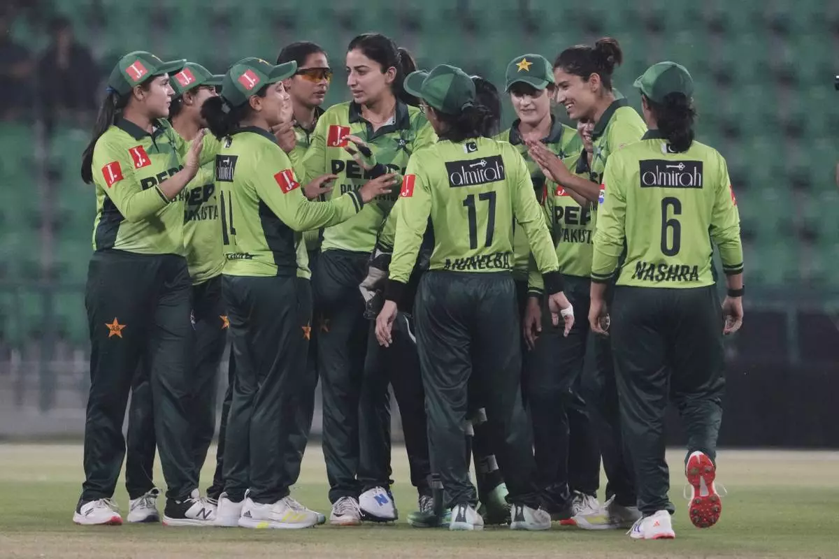 Pakistani players celebrate their win at the ICC Women's World Cup Qualifier match against Thailand in the Gaddafi Stadium, in Lahore, Pakistan, Thursday, April 17, 2025. (AP Photo/K.M. Chaudary)