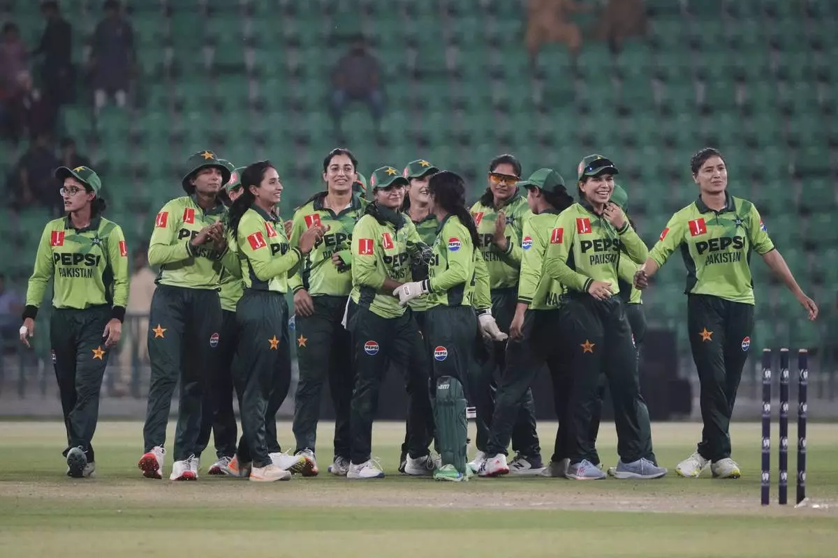 Pakistani players celebrate their win at the ICC Women's World Cup Qualifier match against Thailand in the Gaddafi Stadium, in Lahore, Pakistan, Thursday, April 17, 2025. (AP Photo/K.M. Chaudary)
