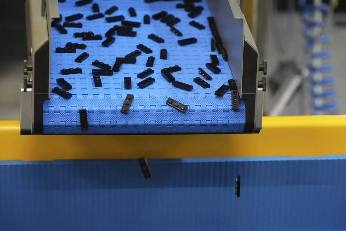 Lego bricks are moved on conveyor belt at Lego factory in Binh Duong, Vietnam Wednesday, April 2, 2025. (AP Photo/Hau Dinh)