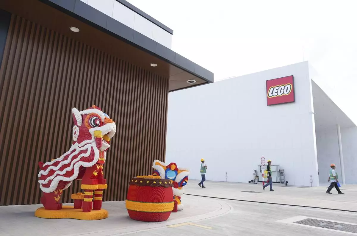 Workers leave work at Lego factory in Binh Duong, Vietnam Wednesday, April 2, 2025. (AP Photo/Hau Dinh)