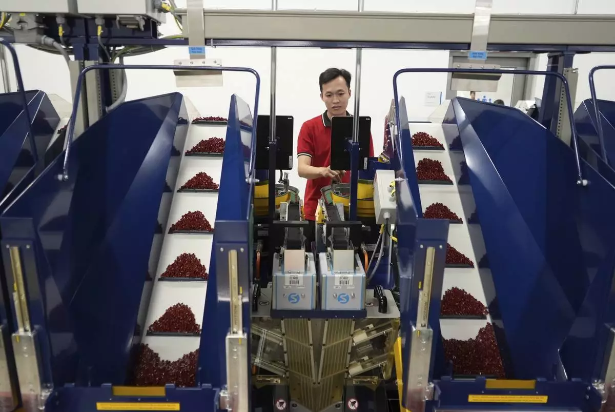 A worker operates packing machines at Lego factory in Binh Duong, Vietnam Wednesday, April 2, 2025. (AP Photo/Hau Dinh)