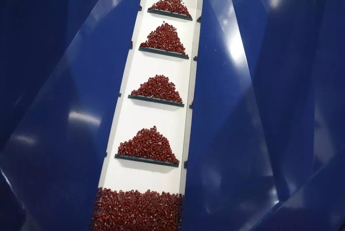 Lego pieces are moved in packing machine at Lego factory in Binh Duong, Vietnam Wednesday, April 2, 2025. (AP Photo/Hau Dinh)