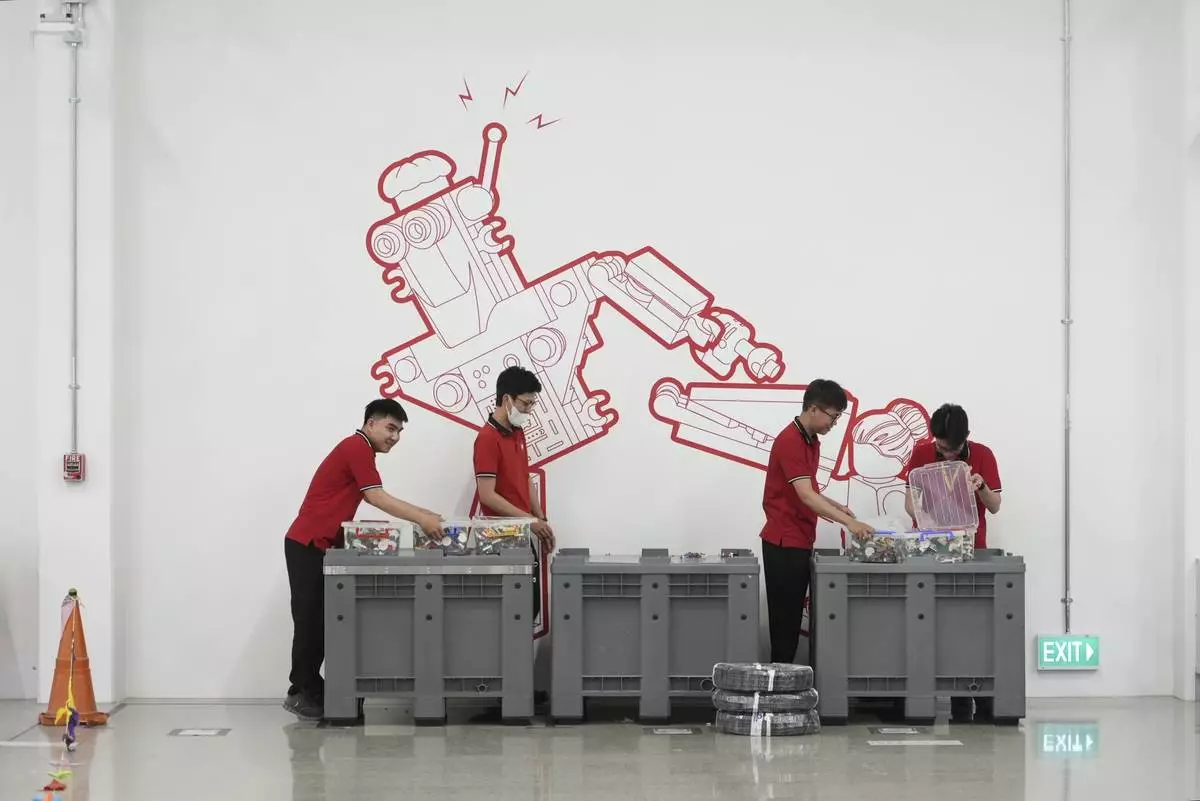 Workers sort out Lego bricks at Lego factory in Binh Duong, Vietnam Wednesday, April 2, 2025. (AP Photo/Hau Dinh)
