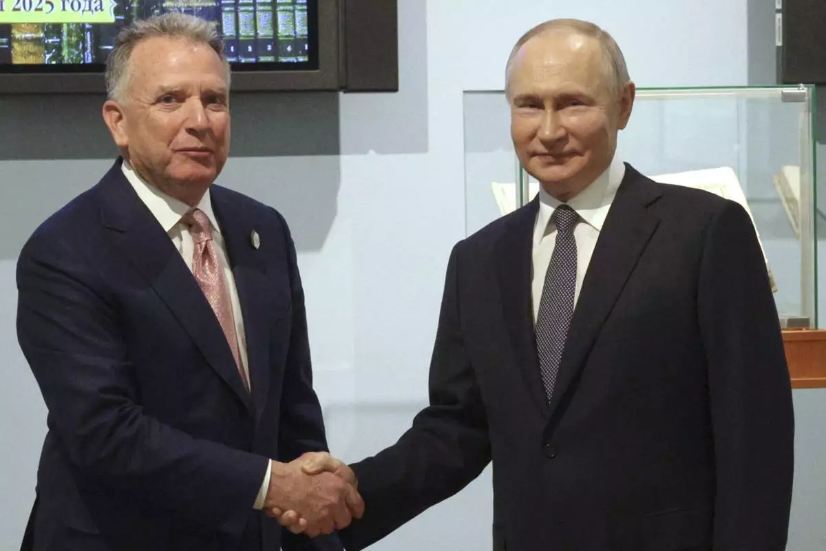 Russian President Vladimir Putin, right, and U.S. President Donald Trump's special envoy Steve Witkoff shake hands prior to their talks in St. Petersburg, Russia, Friday, April 11, 2025. (Gavriil Grigorov, Sputnik, Kremlin Pool Photo via AP)