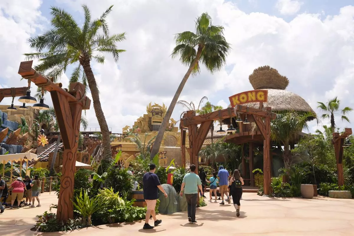 Guests stroll around the various parts of Super Nintendo World at Epic Universe at Universal Resort Orlando Thursday, April 10, 2025, in Orlando, Fla. (AP Photo/John Raoux)