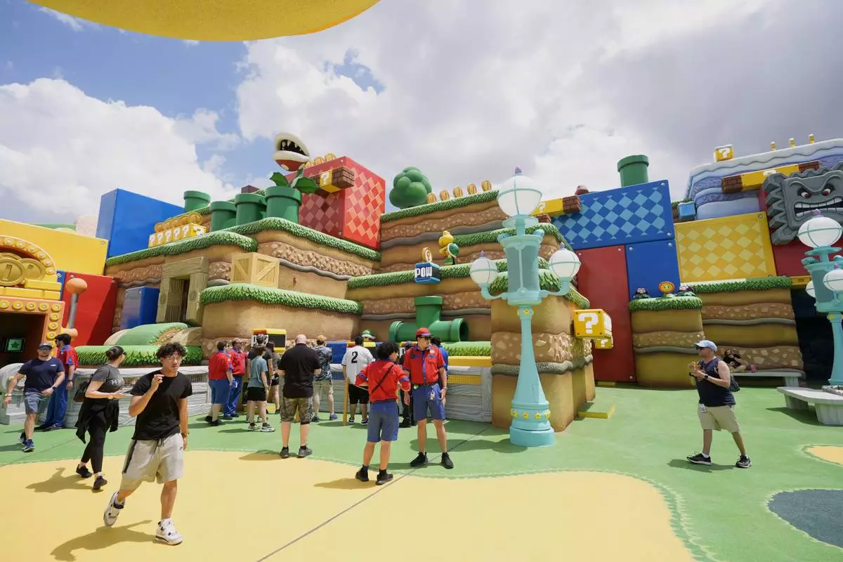 Guests check out the various parts of Super Nintendo World at Epic Universe at Universal Resort Orlando Thursday, April 10, 2025, in Orlando, Fla. (AP Photo/John Raoux)