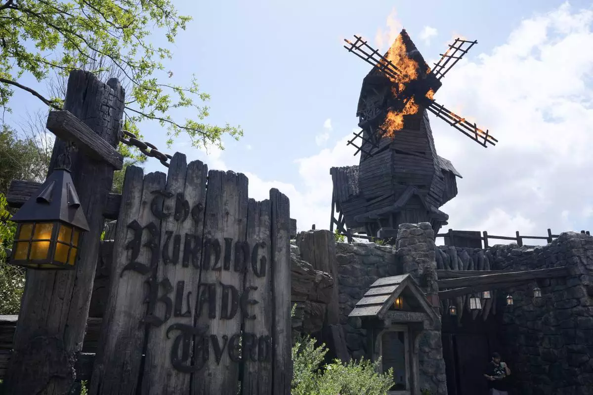 Entrance to the Burning Blade Tavern is seen in Dark Universe at Epic Universe at Universal Resort Orlando Thursday, April 10, 2025, in Orlando, Fla. (AP Photo/John Raoux)