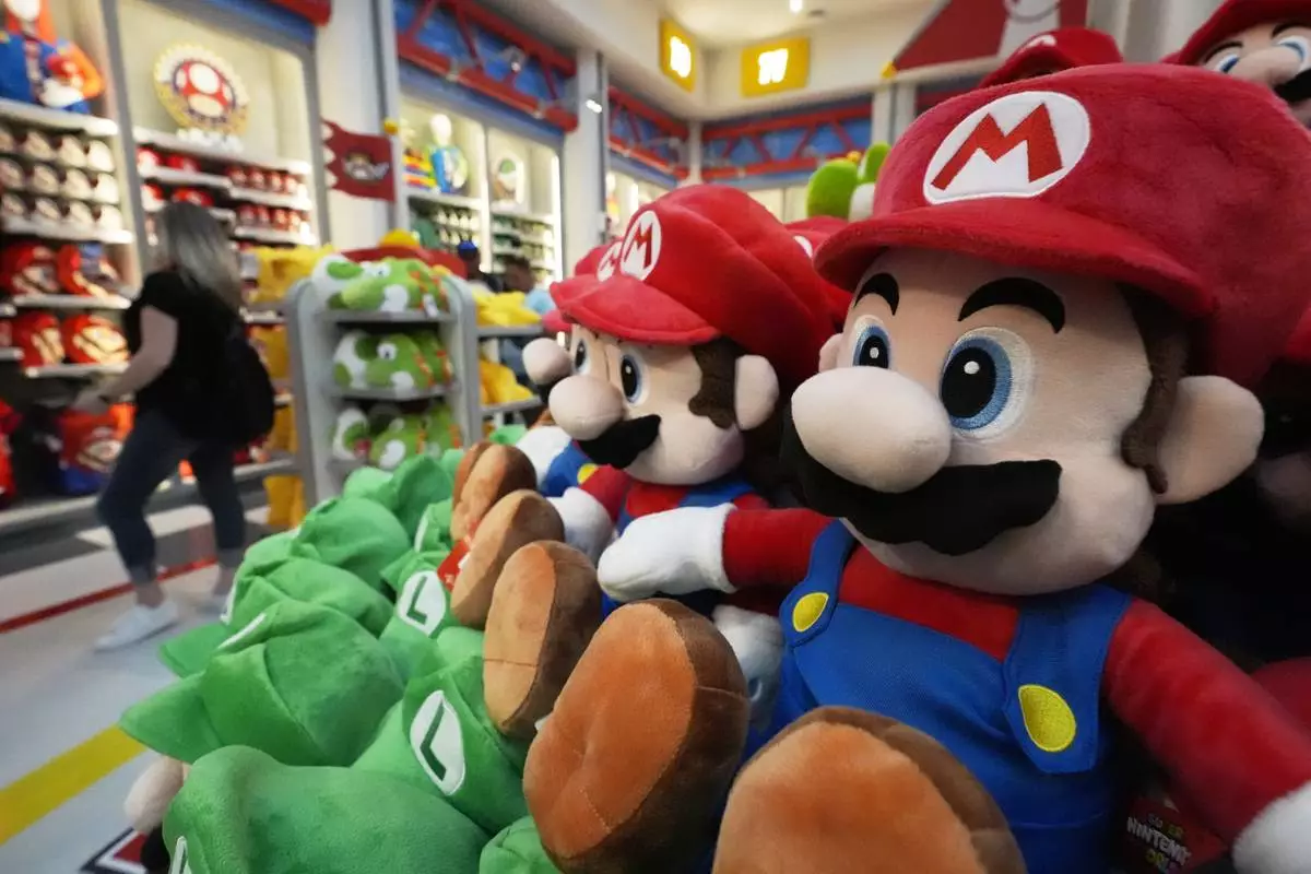 A shopper looks over merchandise for sale in a gift shop at Super Nintendo World at Epic Universe Theme Park at Universal Resort Orlando Thursday, April 10, 2025, in Orlando, Fla. (AP Photo/John Raoux)