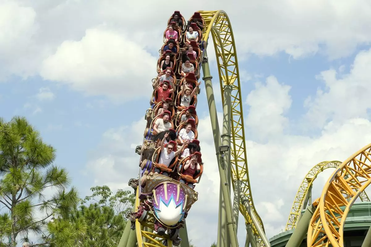 Guests ride on the Stardust Racers roller coaster at Epic Universe Theme Park at Universal Resort Orlando Thursday, April 10, 2025, in Orlando, Fla. (AP Photo/John Raoux)